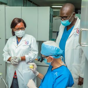 Dr Chapman with Dr Nevis Agirembabazi and Dr Francis Ocheng