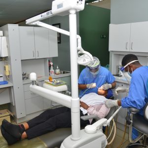 A patient receiving services in the new modern Dental Clinic